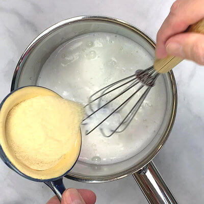 Step 1 - Heat the milk in a saucepan and allow it to come to an almost boil. Reduce the heat and slowly whisk in the semolina.