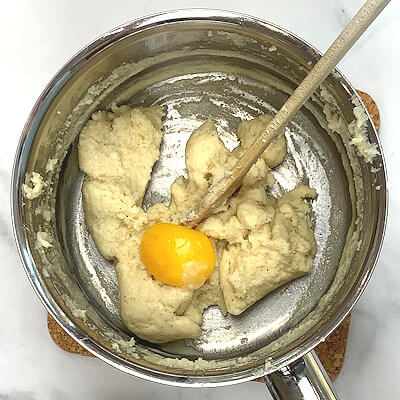 Step 4 - Take pan from heat and add the egg yolk and stir again until fully incorporated.