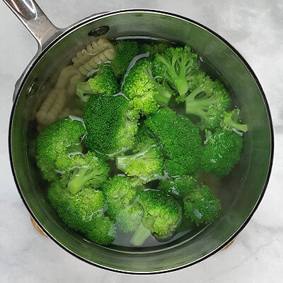 Step 1 - Cook the pasta according to the directions on the packaging. Add the broccoli florets the last 3 minutes of cooking time.