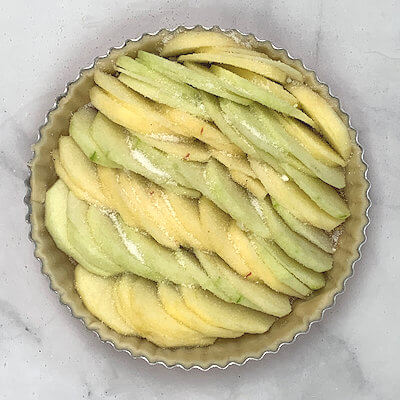 Step 6 - Sprinkle the apple slices with sugar and place the tart in a preheated oven of 425°F for about 20-30 minutes.