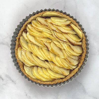 Step 7 - Warm apricot preserves in a microwave and brush it over the apples slices immediately after the pie comes out of the oven.