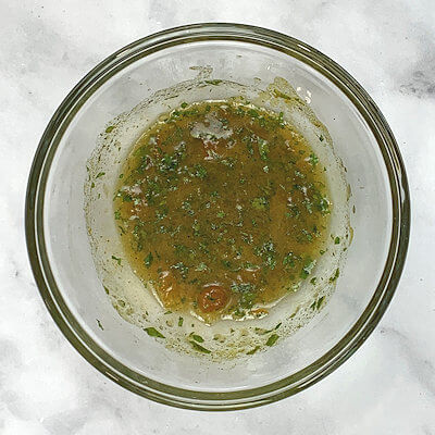 Step 1 - Make the marinade by mixing apricot preserves with mint, salt, pepper, curry powder, garlic paste, olive oil and white wine vinegar.