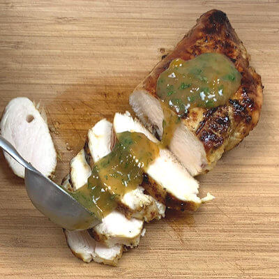 Step 4 - Make the sauce by mixing remaining apricot preserves, fresh mint, Dijon mustard, olive oil, white wine vinegar, finely chopped green onions, salt and pepper. Slice chicken.