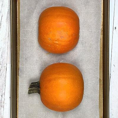 Step 4 - Place the pumpkin halves, cut side down on a baking sheet lined with parchment paper and cook them in an oven of 400°F. Cooking time 40 minutes (for my 2 lbs. pumpkin), but can be more if your pumpkin is larger.