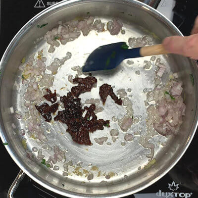 Step 3 - Use same skillet and add olive oil. Transfer shallot and sun-dried tomatoes and saute until shallots are translucent.
