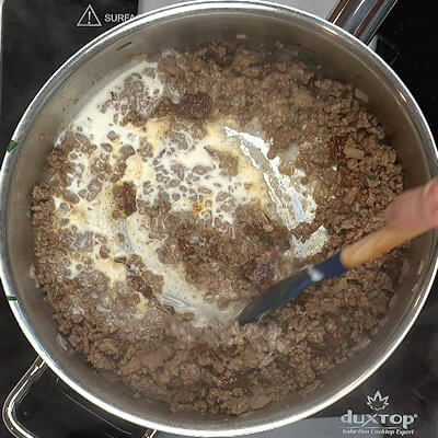 Step 5 - Add stock and cream and stir until most of the liquid has evaporated.
