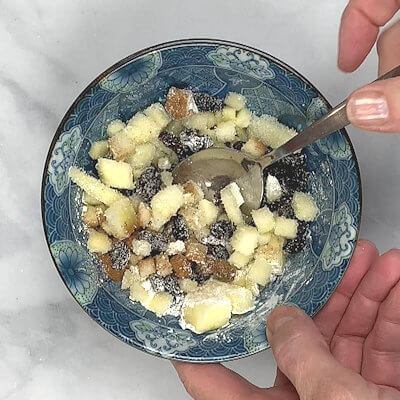 Step 1 - Make the apple filling by mixing the apple (peeled and cut in small cubes), raisins, sugar, corn starch and cinnamon.