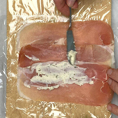 Step 2 - Spread Boursin over the Prosciutto.