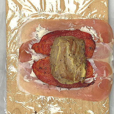 Step 4 - Place pork tenderloin in the middle of the roasted pepper.