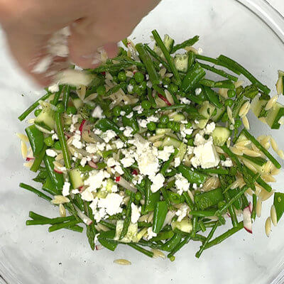 Step 7 - Crumble the feta on top of the salad and give it a last mix.
