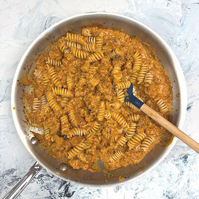 Step 4 - Add sauce to the skillet with the meat and then add the pasta. Mix well.