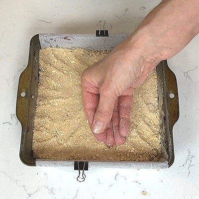 Step 4 - Divide the remaining flour-oat mixture over the blackberry layer and gently press down. Bake in a preheated oven of 350 degrees F. for about 35 minutes or until golden brown and slightly bubbly.