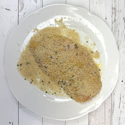 Step 3 - Mix the bread crumbs with the cheese and the finely chopped sage. Transfer the egged chicken cutlets to the bread crumbs mix and coat on both sides.