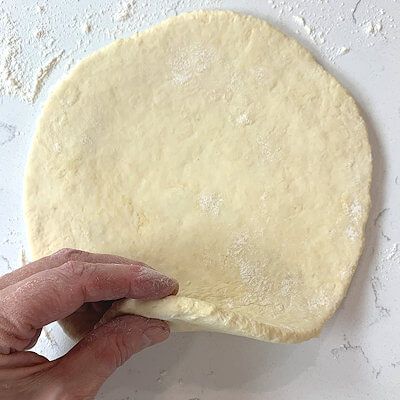 Step 3 - Flour your counter and roll out dough, until about ½ inch thick.