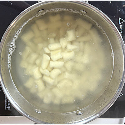 Step 6 - Put water on the stove and bring to a boil. Add gnocchi to the boiling water and wait until the pillows float to surface.