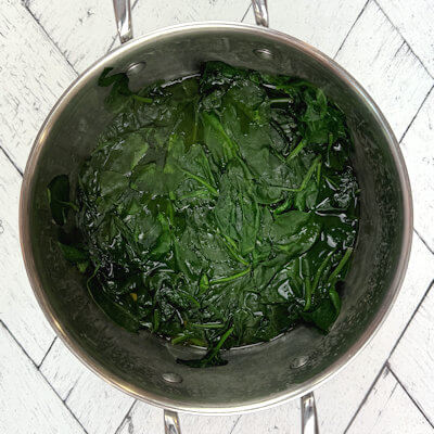 Step 1 - Blanch the spinach in a little bit of water over high heat, until the spinach has wilted. 