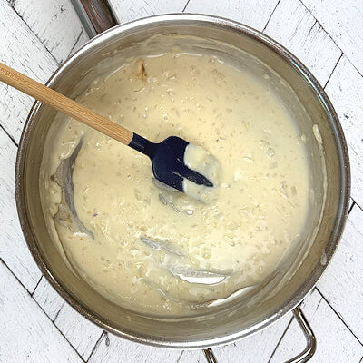 Step 3 - Add milk and ricotta and still. Simmer on low heat for about 3-5 minutes, allowing the sauce to thicken. Add the grated cheese and season with salt, pepper and nutmeg. 