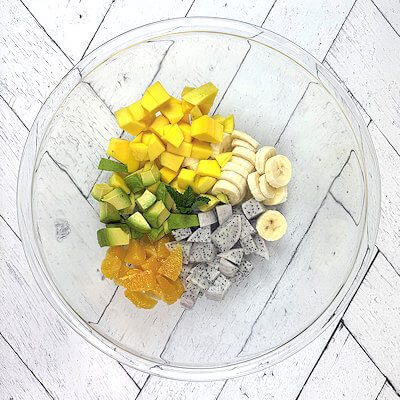 Step 1 - Cut all the fruits into similar sized cubes or slices and transfer them to a bowl.