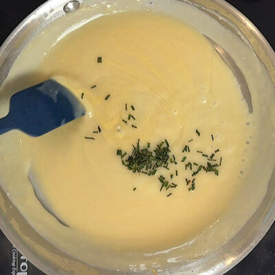 Step 4 - At the end, add some chives to the sauce. Other herbs are possible as well, but the chives communicate well with the scallions in the turkey ricotta meatballs.