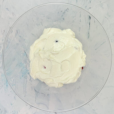 Step 3 - Mix the yogurt with the ricotta and spoon half of this mixture on top of the berries.