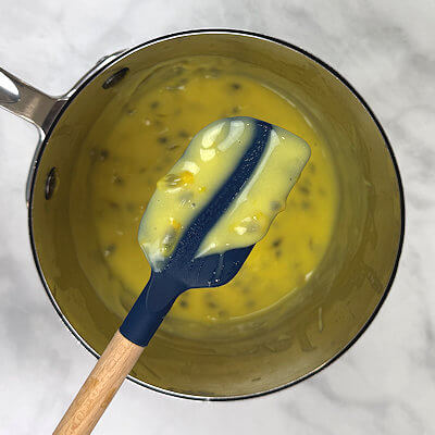 Step 3 - Transfer the mixture to a saucepan and cook over low-medium head. Do NOT boil and stir constantly. The mixture will thicken in about 10-15 minutes and will leave a path on the back of the spatula.