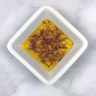 Soak the saffron in a little bit of hot stock for about 10 minutes. 