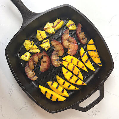 Step 2 - Heat a grill pan and grill the fruit pieces until they grill marks appear on both sides, about 3 minutes in total.