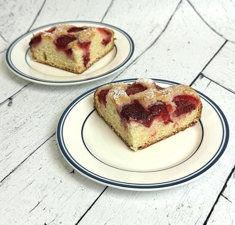Strawberry cake wedges with powdered sugar on top.