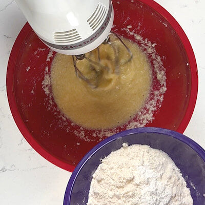 Step 3 - In a separate bowl, mix all-purpose flour, baking powder and salt. Gradually, add this flour mixture to the butter mixture.