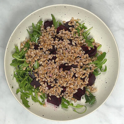 Step 5 - Add the cooked farro. Decide whether you want to mix the salad or keep the layers more or less separate. I prefer to not mix the salad more than necessary to preserve the colors of the individual ingredients. Beets have a very strong color that will stain everything it comes in contact with.