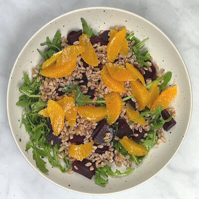 Step 6 - Divide the orange sections over the salad.