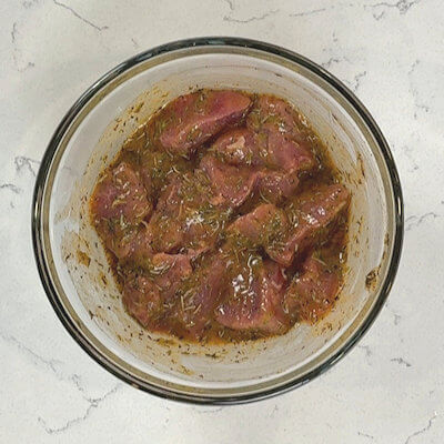 Step 1 - Slice the tenderloin in 1-inch cubes. In a bowl, whisk together the lemon juice, honey, mustard, garlic paste, rosemary, thyme, smoked paprika, salt & pepper. Add the pork, stir well to coat all the meat cubes. Cover and marinade in the fridge for minimum 30 minutes.