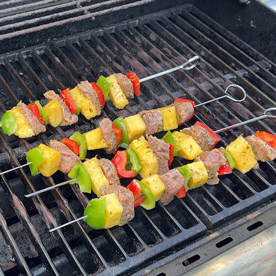 Step 3 - Lightly brush the skewers on all sides with olive oil and place them directly on the grill grates. Grill for about 7 minutes on each sides and rotate 2-3 times. The internal temperature of pork needs to reach about 145 degrees F.