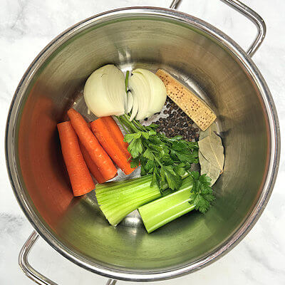 Step 1 - Place clean vegetables, herbs, spices and in a large pot.
