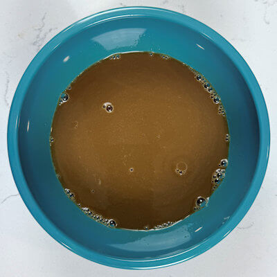 Step 2 - Mix the wet ingredients; honey, molasses and milk.