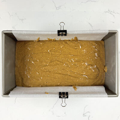 Step 3 - Add the wet mixture to the dry mixture and combine until no lumps are left. Do not over mix. Pour the batter in a cake form (9x5"), lined with parchment paper.