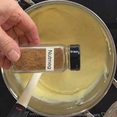 Step 6 - Season the Pommes Aligot with salt, pepper and nutmeg and mix it. 