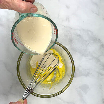 Step 4 - In a bowl, mix the egg yolk with the granulated sugar. Slowly add the cooked rice to the egg mixture, while whisking.