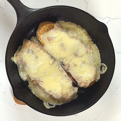Step 3 - Place the skillet in preheated oven of 450 degrees F and cook for about 10 minutes or until the cheese is totally melted.