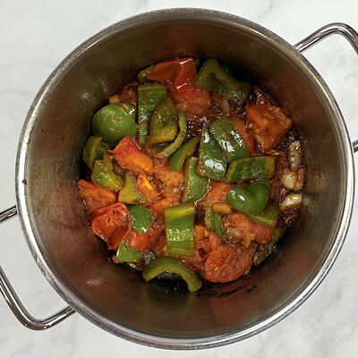 Step 3 - Add the chopped tomatoes and cook them for about 5 minutes. They will start falling apart.