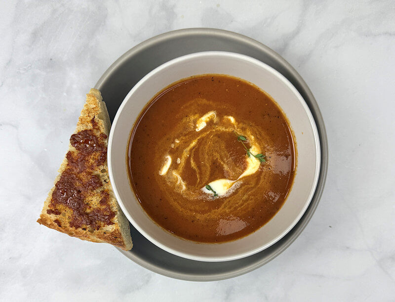 Step 6 - Stir the cooked chorizo back into the soup and warm for a few minutes. Season with salt & pepper if needed. Divide soup over 2 bowls and swirl in the creme fraiche. Sprinkle with fresh or dried thyme. Serve the toasted chorizo bread along side.