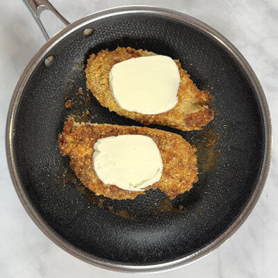 Step 6 - Top each cutlet with a thin slice of Mozzarella cheese. Broil for a few minutes or until the cheese is melted and bubbly.