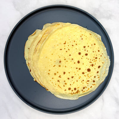 Step 4 - Transfer the crêpe to a plate and continue baking with the remaining batter.