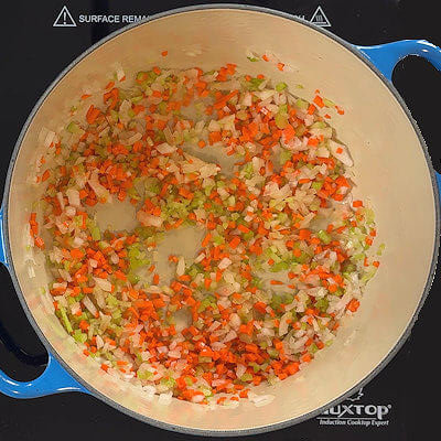 Step 2 - Heat oil in a Dutch oven over medium-low heat. Add the onion, carrot and celery and cook, stirring occasionally, until softened but not browned, about 6 minutes.
