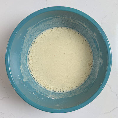 Step 2 – Mix flour and salt. Add the egg mixture, little by little and mix until combined. If you have tiny lumps, you can strain the batter.