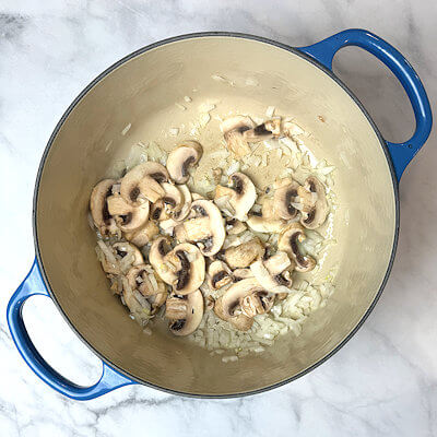 Step 3 - Heat oil in a Dutch oven, add the onion, garlic and mushrooms and saute until tender and translucent. Caramelize a little to reach optimum umami.