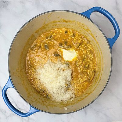 Step 6 - Add Mascarpone cheese and grated Parmigiano Reggiano cheese. Stir until fully incorporated.