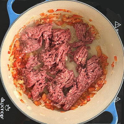 Step 3 - Add the ground beef, breaking it into small pieces as it cooks.