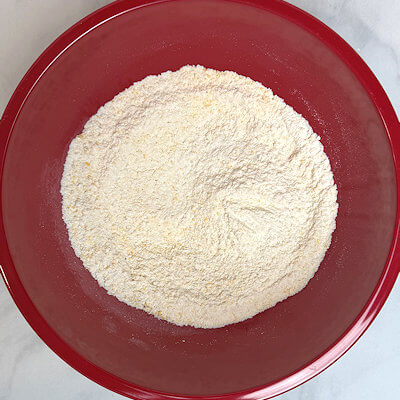 Step 1 - In a bowl, mix together the dry ingredients: cornmeal, all-purpose flour, sugar, baking powder, baking soda and salt.