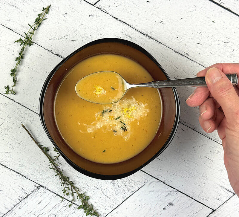 Mix grated Taleggio cheese with lemon zest and sprinkle that over the soup. As a last touch add some thyme leaves.